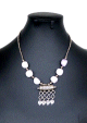 Collier artisanal marocain avec pierres blanches agrémenté de breloques gravées argentées Collier artisanal marocain avec pierres blanches agremente de breloques gravees argentees