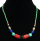 Collier ethnique artisanal imitation pierres multiformes agrémentées de perles multicolores Collier ethnique artisanal imitation pierres multiformes agrémentées de perles multicolores