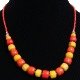 Collier ethnique artisanal grosses perles jaunes et rouges agencé de petites perles rouges corail et argentées Collier ethnique artisanal grosses perles jaunes et rouges agence de petites perles rouges corail et argentees